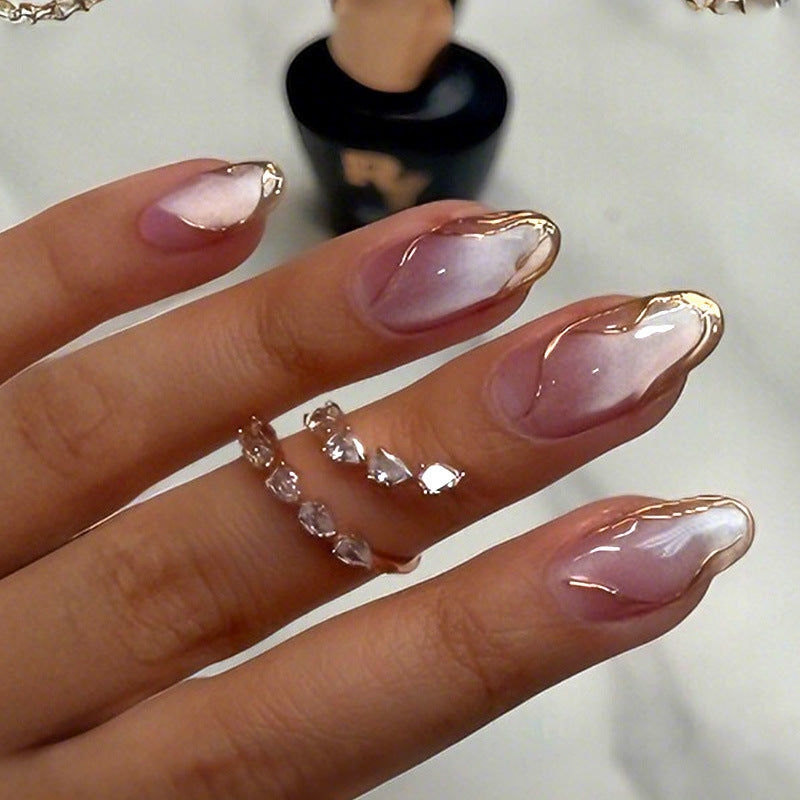 Acrylic nail set with glamorous gradient and golden accents Kalsten