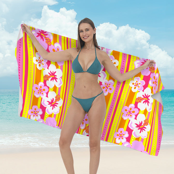 Beach towel with vibrant tropical plant motif Kalsten