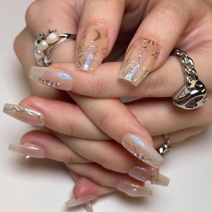 Artificial nail art with elegant rhinestone and glitter effects Kalsten