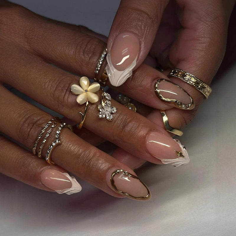 Acrylic nail set with elegant floral designs and glamorous accents Kalsten