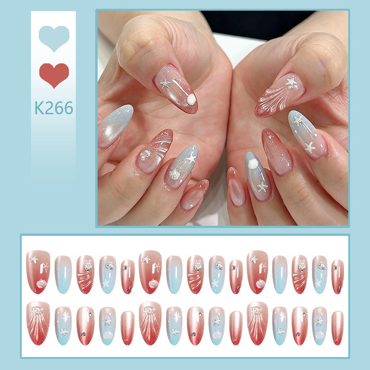 Artificial nails with sparkling rhinestone embellishments and maritime design Kalsten