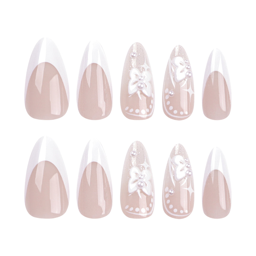 Artful stiletto nails with floral designs and glitter accents Kalsten