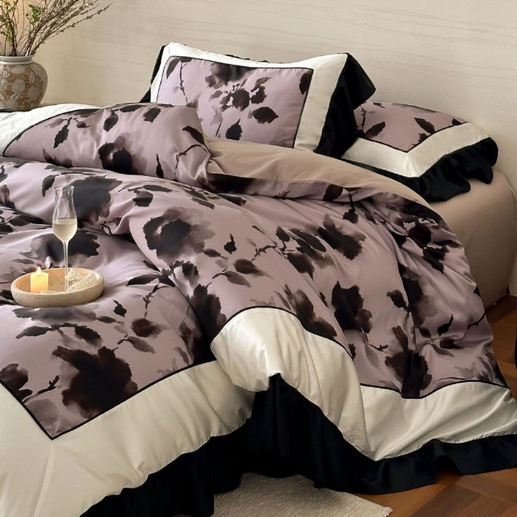 Satin bedding set with watercolored floral print, contrasting piping and flowing ruffles