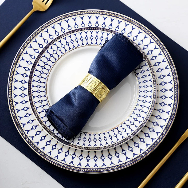 Luxurious metal napkin ring with Greek meander ornament