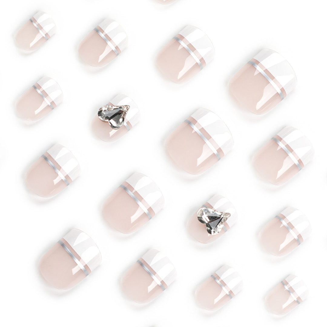 Elegant Nail Art with Glitter Accents and Jewelry Details Kalsten
