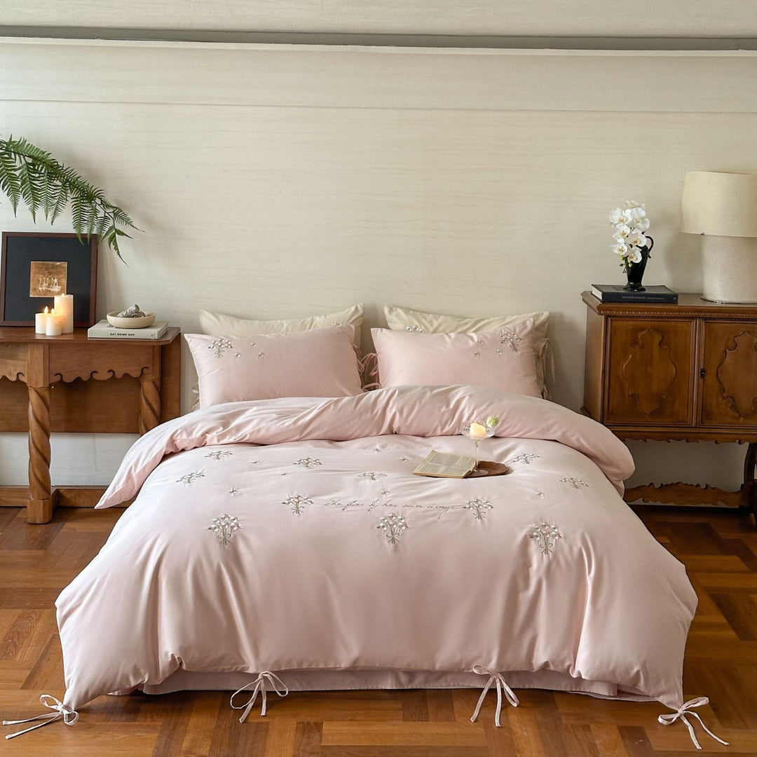 Luxurious satin bedding set with delicate pearl flower embroidery and tie ribbons