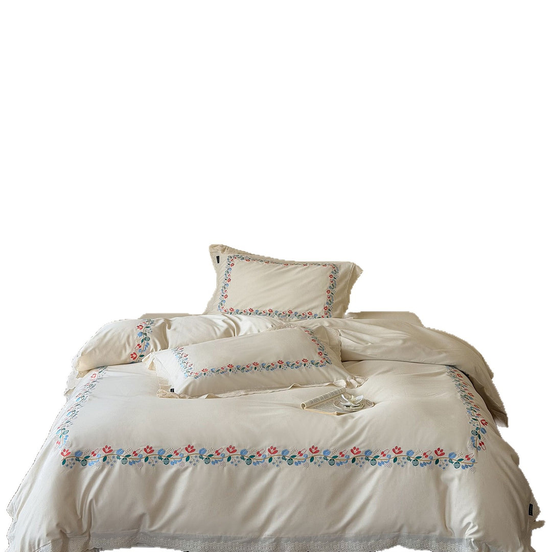 Embroidered cotton satin bed linen set with floral border and fine lace edge