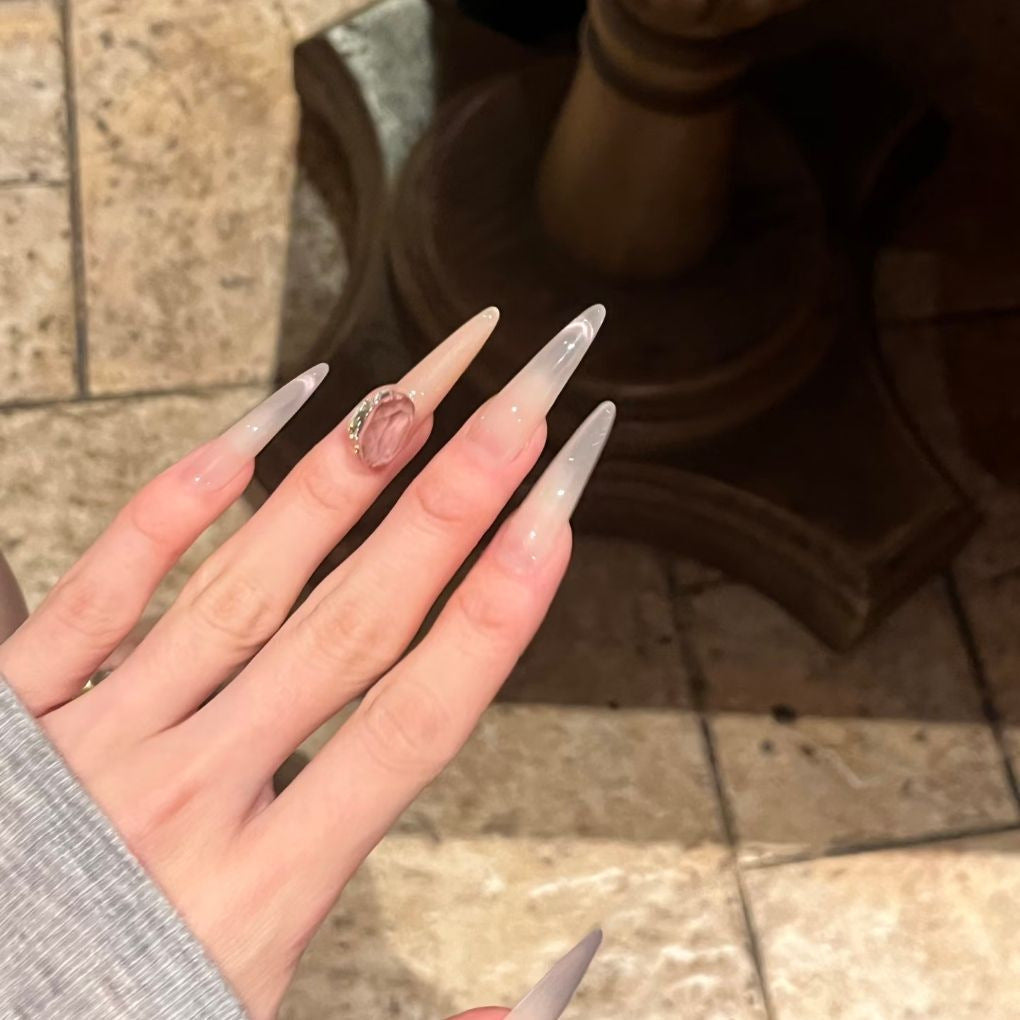 Glamorous Stiletto Nail Art Extensions with Decorative Accents