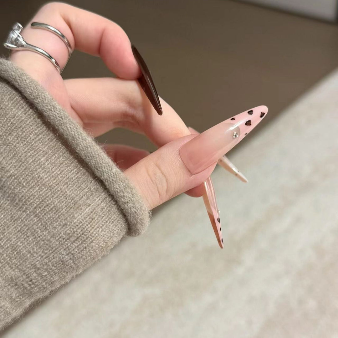Artistic Stiletto Nail Extensions with Patterned Designs