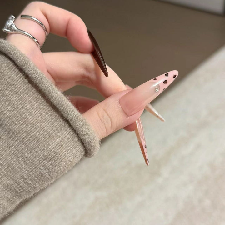 Artistic Stiletto Nail Extensions with Patterned Designs