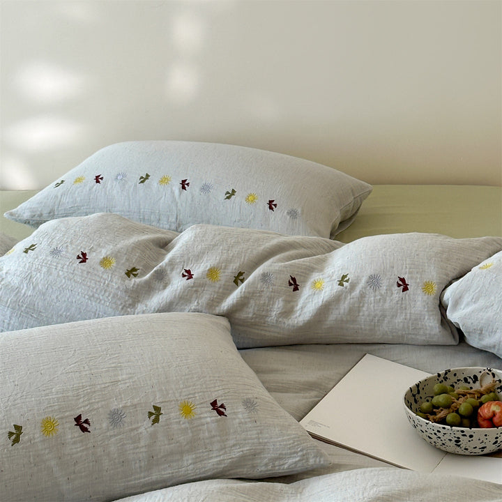 Bedding set in linen look with subtle embroidered border