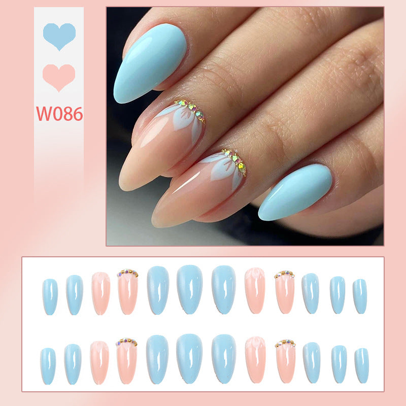 Artificial nails with elegant leaf patterns and rhinestone embellishments Kalsten
