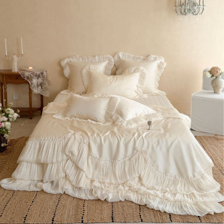 Romantic satin bedding and bedspread set with decorative ruffles and bows