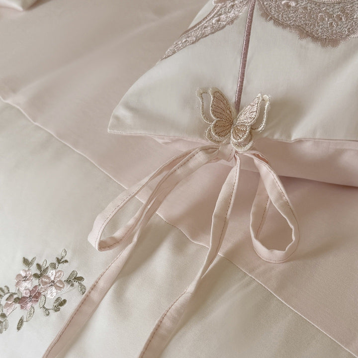 Luxurious embroidered satin bedding set with ruffled hem