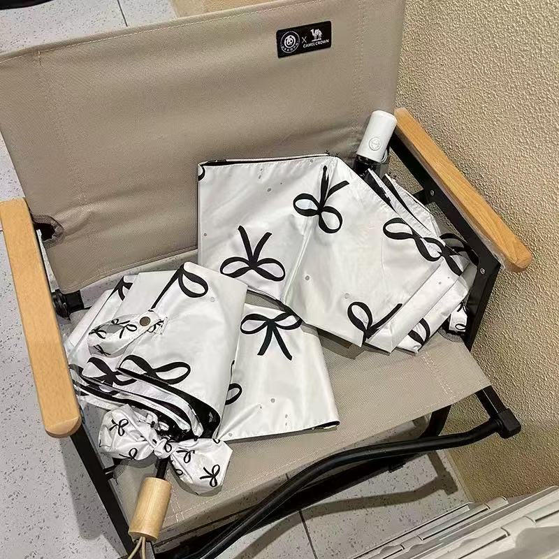 Women's foldable umbrella with elegant bow design Kalsten