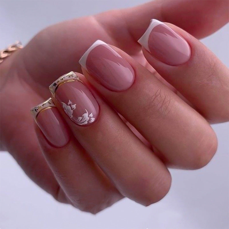 Artful nail art with elegant French tip and floral accents Kalsten