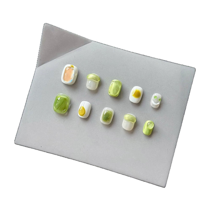 Artistic Press-On Nail Art Set with Playful Character Designs