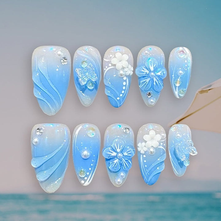 Creative nail set with floral accents and glittering details Kalsten