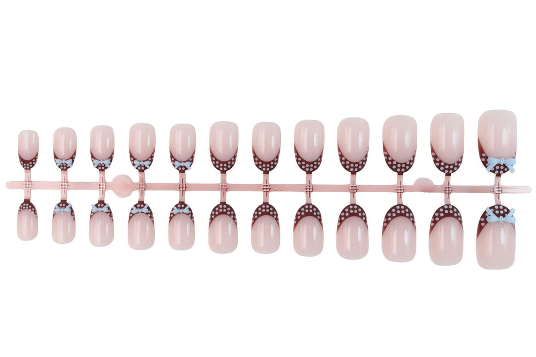 Artificial nail set with playful bows and elegant dots Kalsten