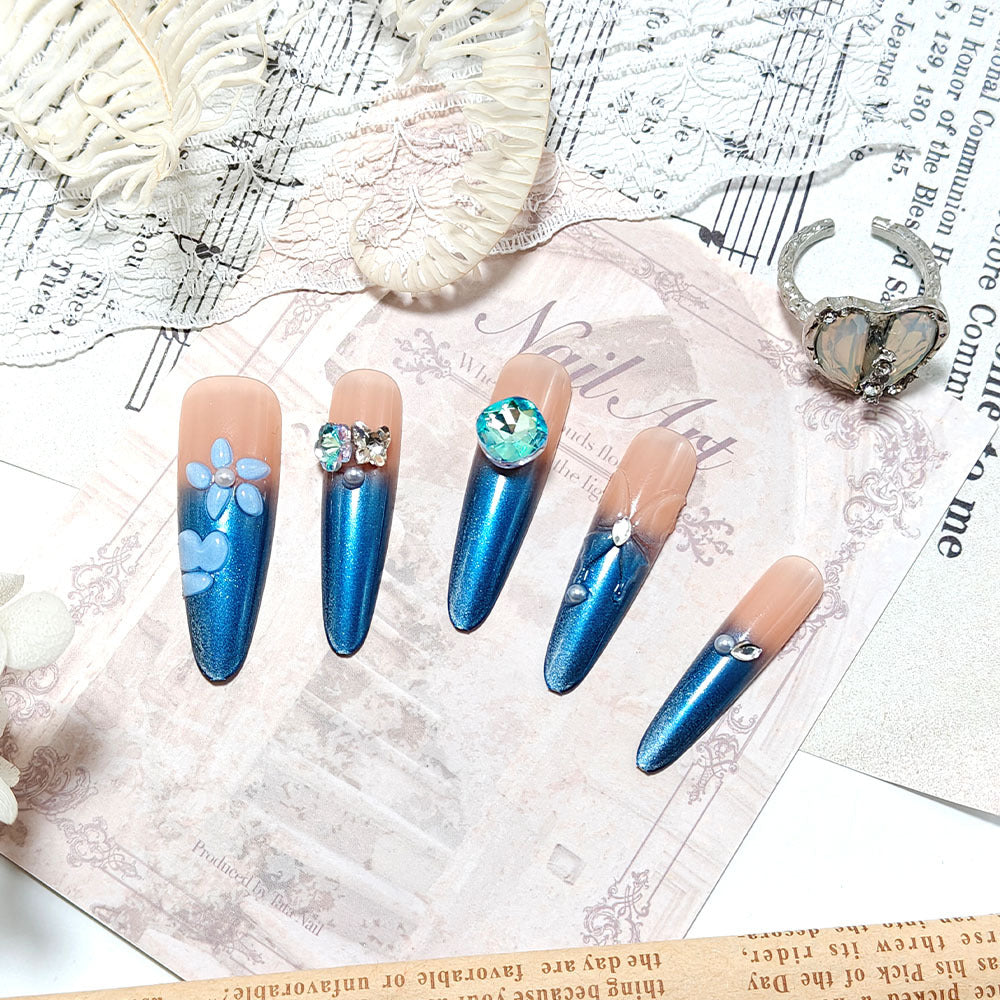 Artificial nails in elegant design with artistic decorations and glitter accents Kalsten