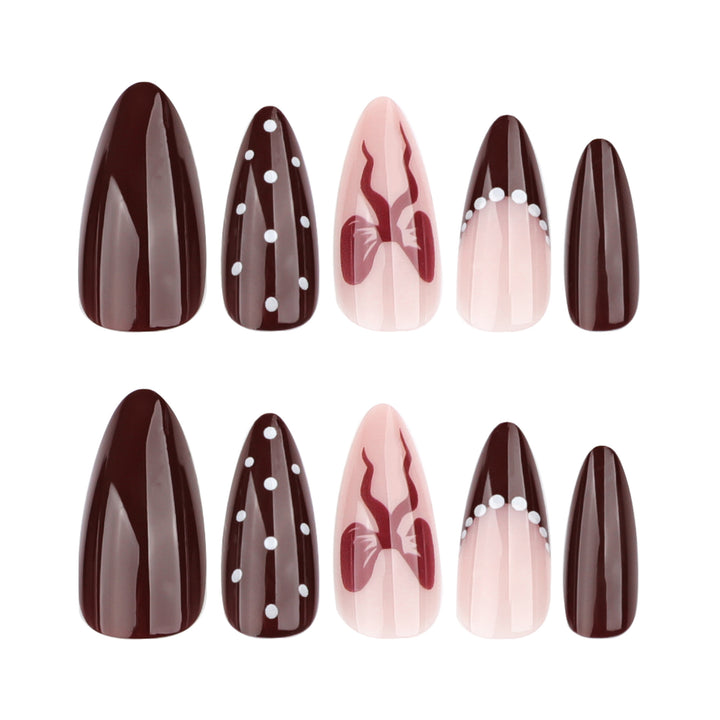 Elegantly designed stiletto nails with artistic accents Kalsten
