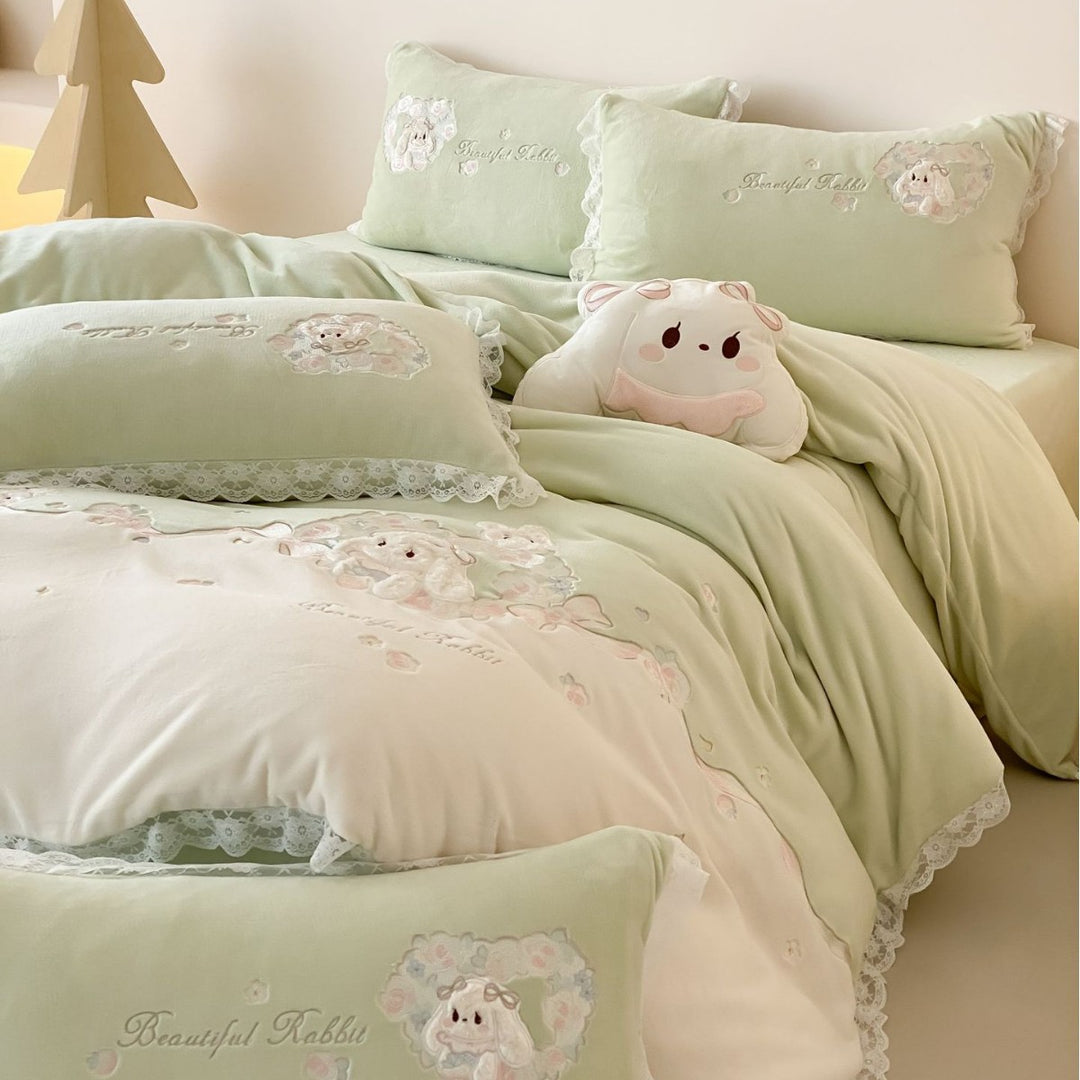 Romantic children's bedding set with embroidered bunny appliqués and lace ruffle