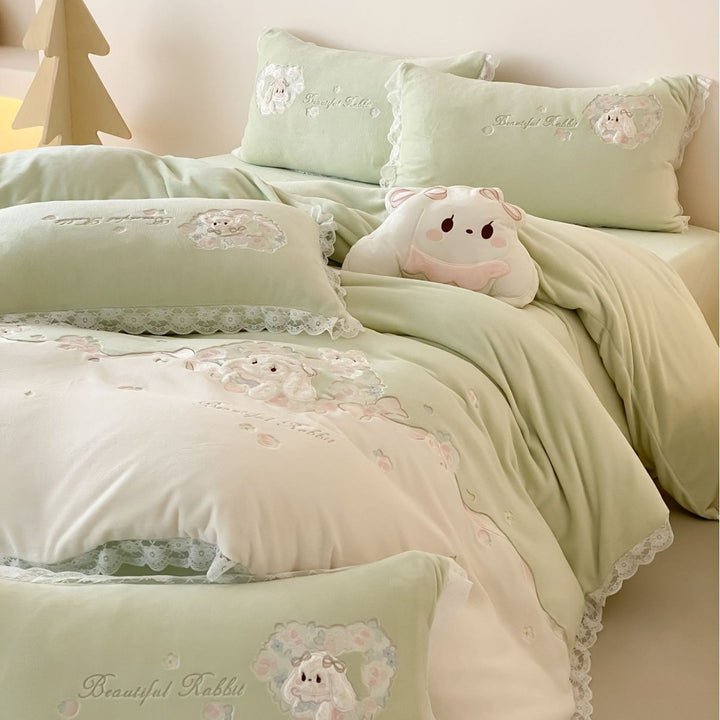 Romantic children's bedding set with embroidered bunny appliqués and lace ruffle