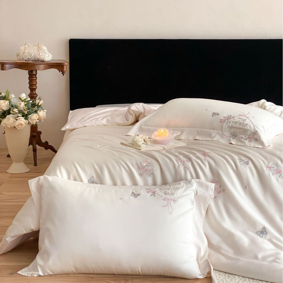 Luxurious embroidered cotton satin bedding set with delicate butterfly and flower appliqués