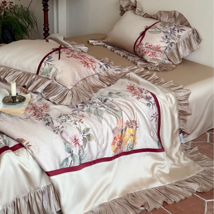 Romantic satin bedding set with ruffles, floral embroidery and reversible function