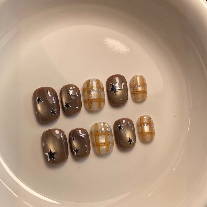 Artistic Nail Art Set with Unique Star and Plaid Designs