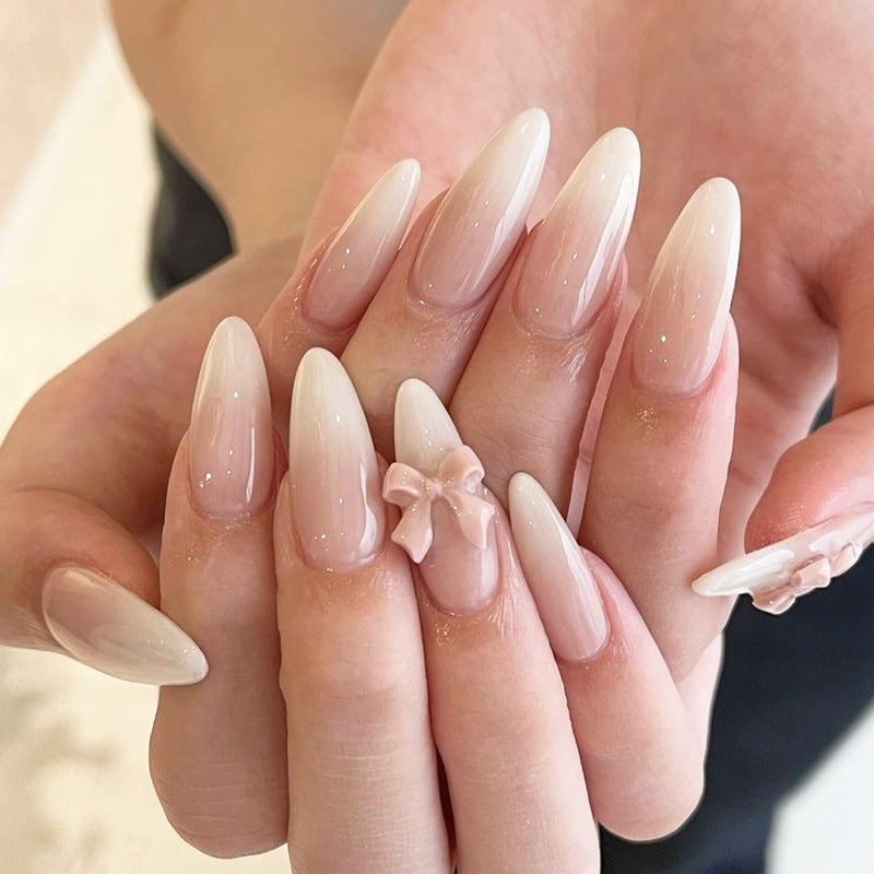Elegant artificial nail set with luxurious ombre effect and delicate bow accents Kalsten