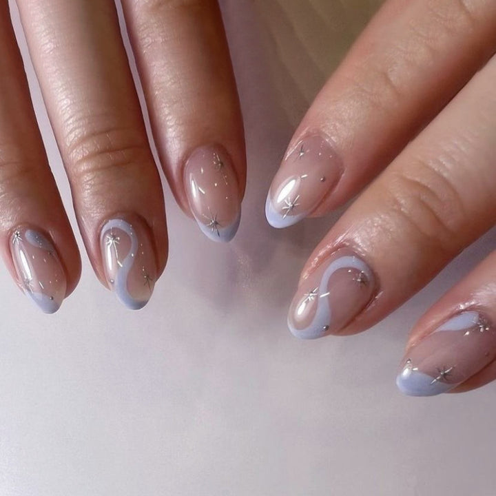 Artful nail art with elegant wave lines and glitter effects Kalsten