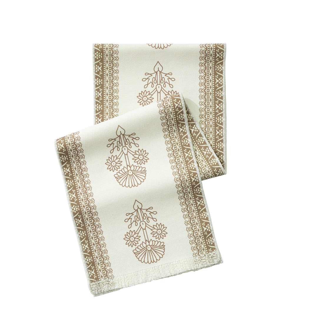 Table runner made of woven cotton blend with floral border