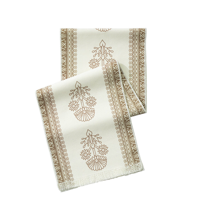 Table runner made of woven cotton blend with floral border