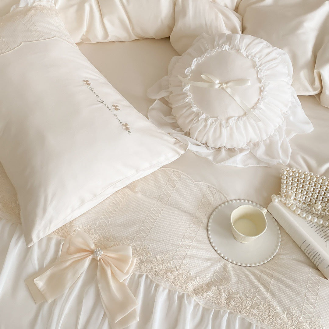 Romantic ruffle duvet cover set with frill, bow appliqué and delicate embroidery