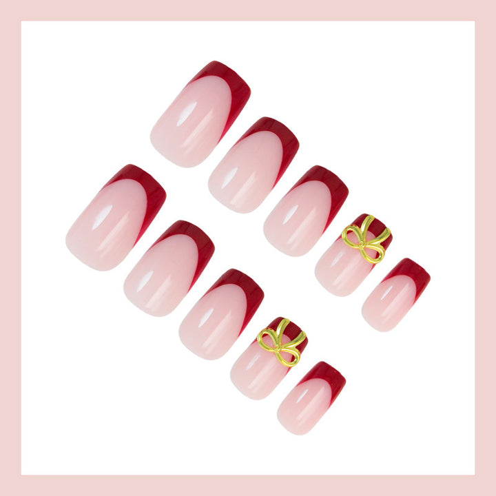 Artificial nail set with elegant red tips and refined bow decorations Kalsten