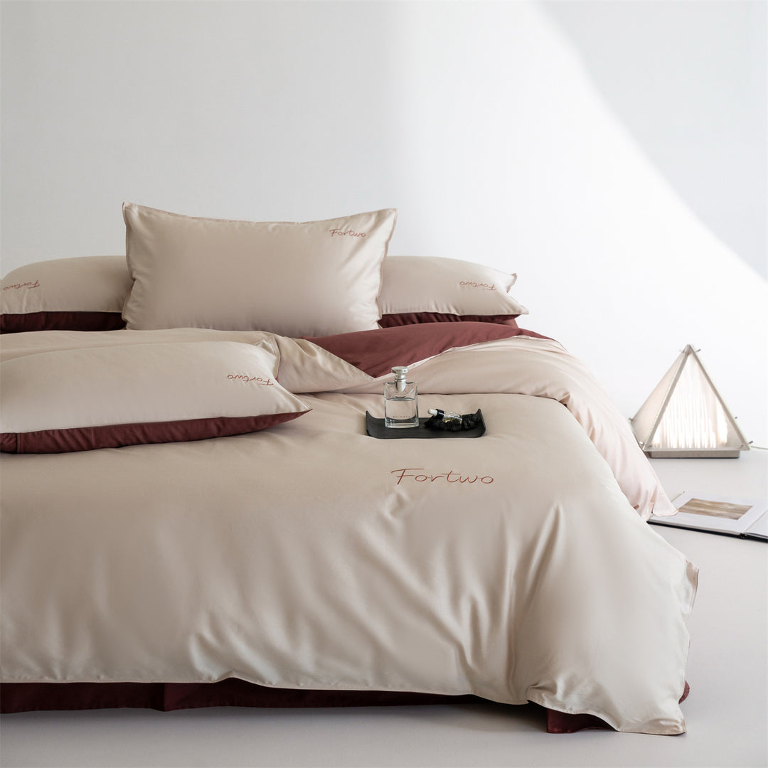 Reversible satin bedding set with fine tone-on-tone embroidery