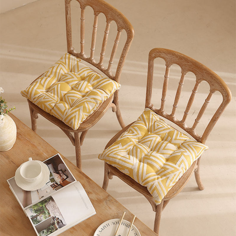 Padded quilted seat cushion with colorful button applications and non-slip underside Kalsten