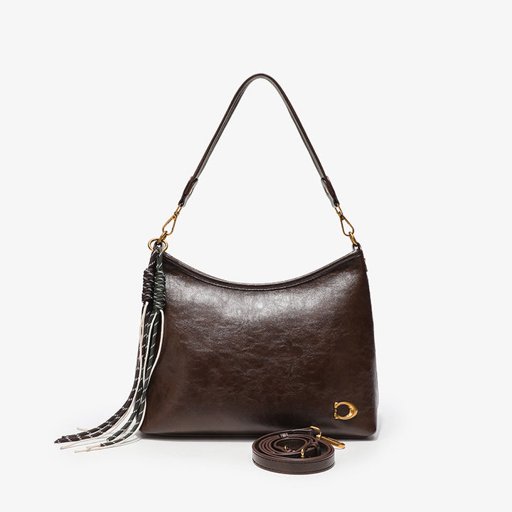 Elegant Hobo Handbag with Decorative Tassels