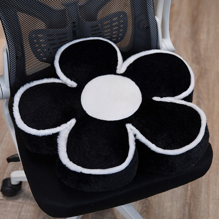 Padded seat cushion in flower shape with faux leather center piece and fluffy edge padding