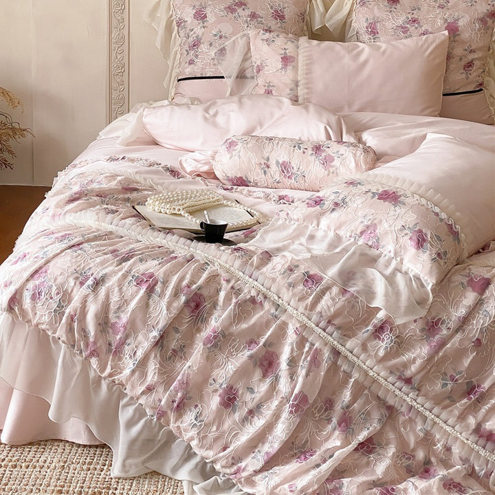 Romantic quilted bedding set with ruffles and floral pattern