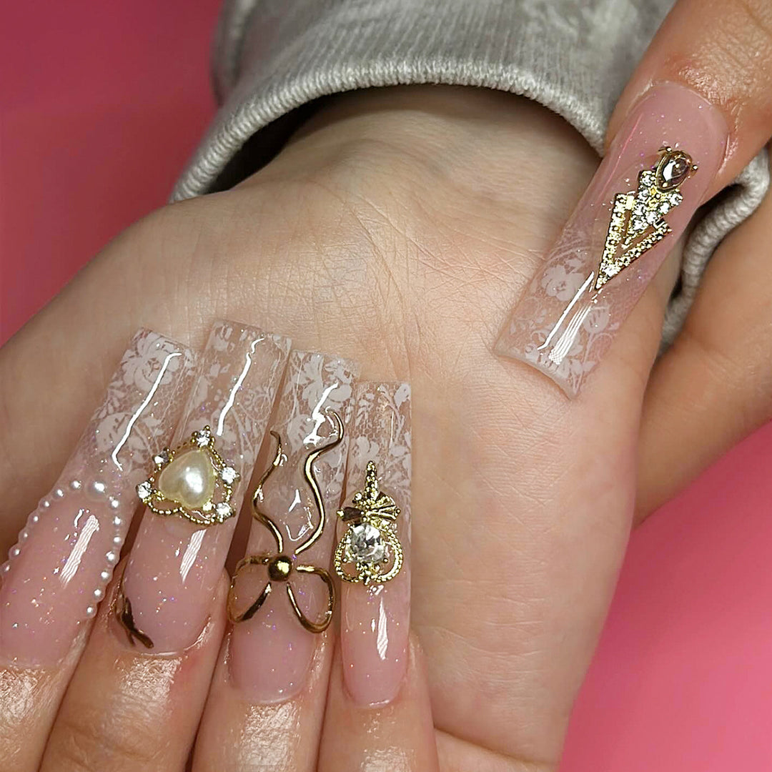 Artistic Long Nails with Elegant Gold Accents Kalsten