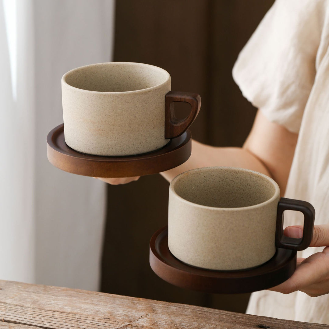 Ceramic mug with wooden handle and saucer