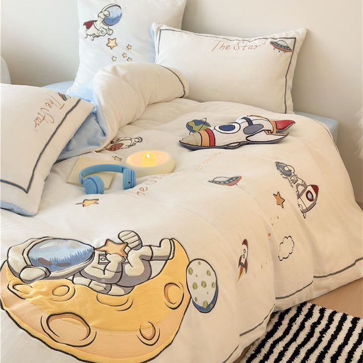 Child bedding set made of soft cotton blend with embroidered astronaut and rocket motif
