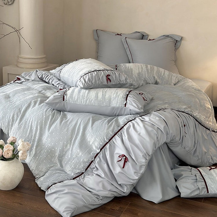 Bedding set made of velvety microfiber with ruffles, decorative ribbons, and quilted texture