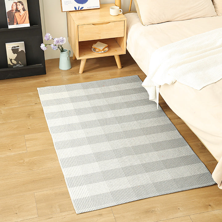 Modern flat-weave area rug with contrasting stripes and non-slip underside Kalsten