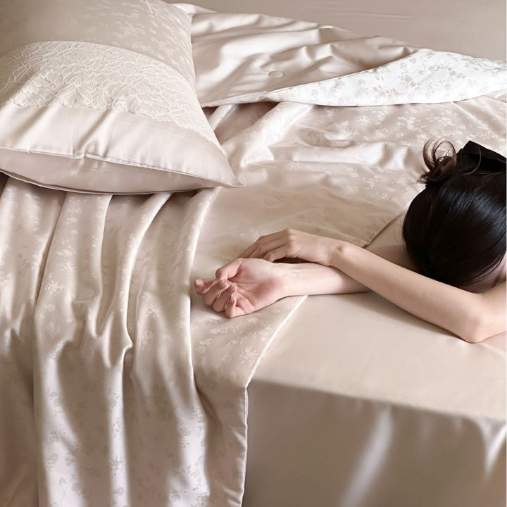 Luxurious satin bedding set with lace appliqué and jacquard pattern