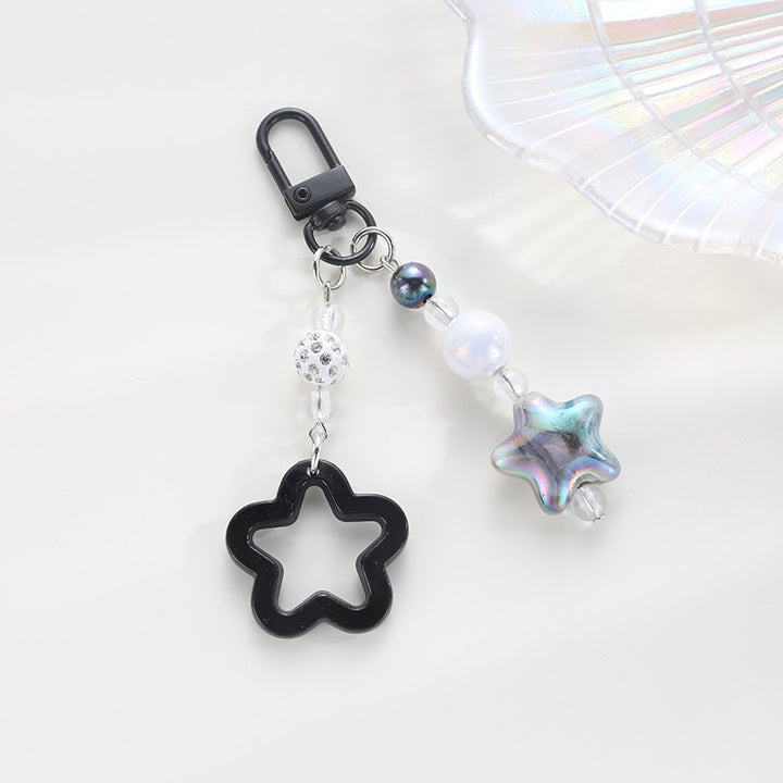 Playful keychain with floral and star motif Kalsten