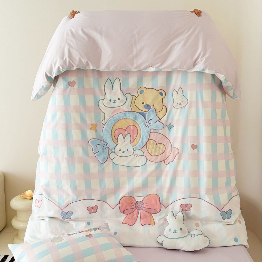 Playful cotton bedding set with embroidered bunny and cherry motif including decorative pillow