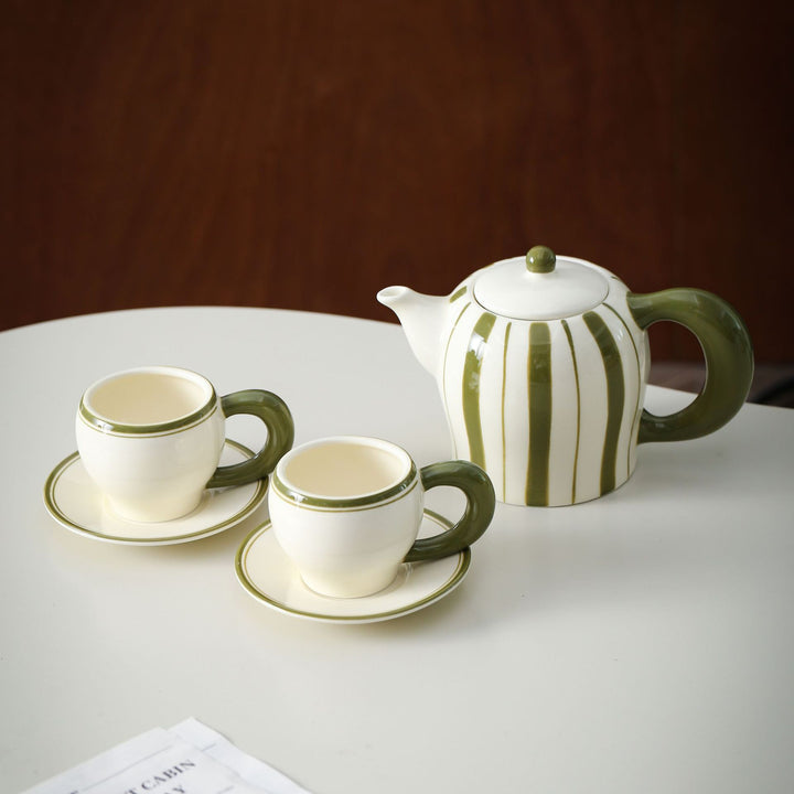 Porcelain tea set with vertical stripe decor and ergonomic handles